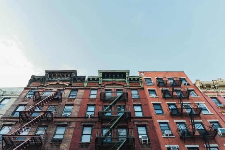 Brick building with external fire escapes.